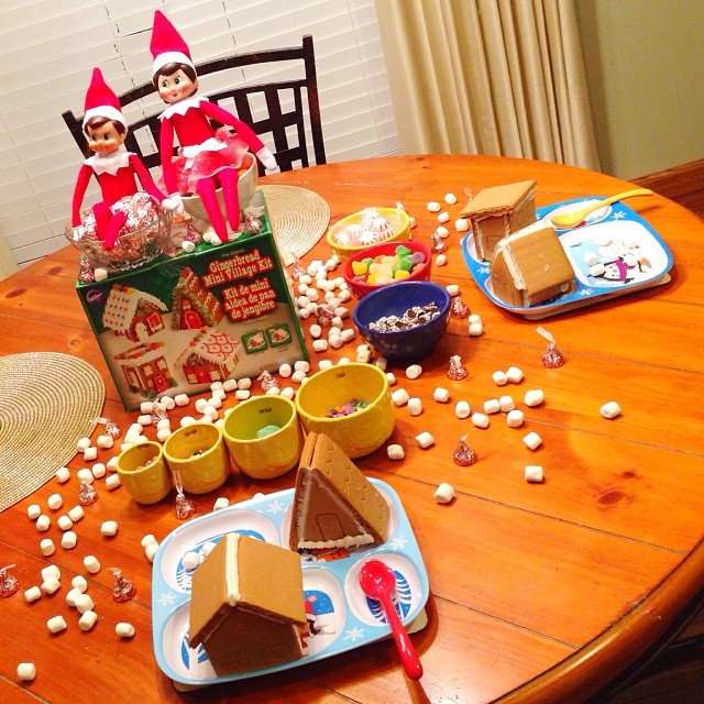 Tonight while the kids are asleep, Elfie and Samantha brought a mini gingerbread village with four houses to decorate with lots and L.O.T.S. of candy!! One of the houses looks kind of like an out house???! Hmmm, Nathan will get a kick out of that one for