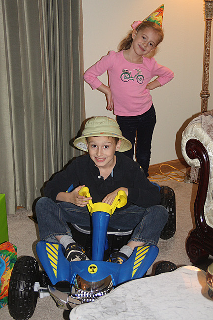 Nat-in-his-car-with-sis-by-presents