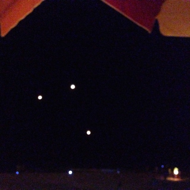 Watching barrel lanterns floating above the beach as we eat dinner. Â Feel like I am in the Tangled movie! So, so cool!