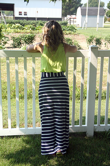 Back-view-leaning-against-fence