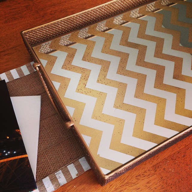 Happy Fall Y'all!! Â I decided to clean out our entire coffee table (it has a ton of storage underneath) and buy a new tray for the top of it. This gold chevron mirror tray was 50% off at Hob Lobs! I couldn't believe it! I also bought some fall decor to de