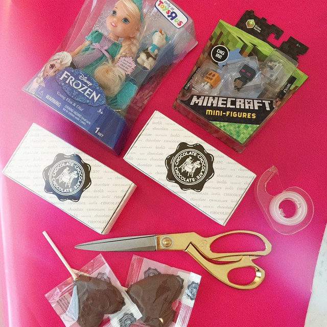 Doing a little Valentine's gift wrapping while the kids are in school and before their class parties. Every year I get them a little toy and chocolate pops from Chocolate Chocolate. 🍫🍫🍫 I always got Nathan his fav