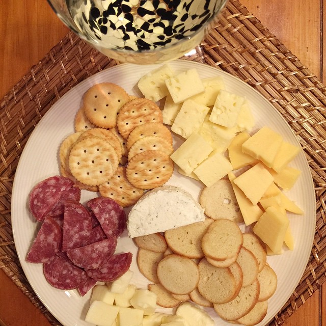 My favorite kinda dinner... I call it the 'picnic' dinner. All kinds of different cheeses, bagel chips and crackers and a red wine sausage... The wine is a Camelot mead honey wine from a local winery, so refreshing! Just what I needed tonight with the hub