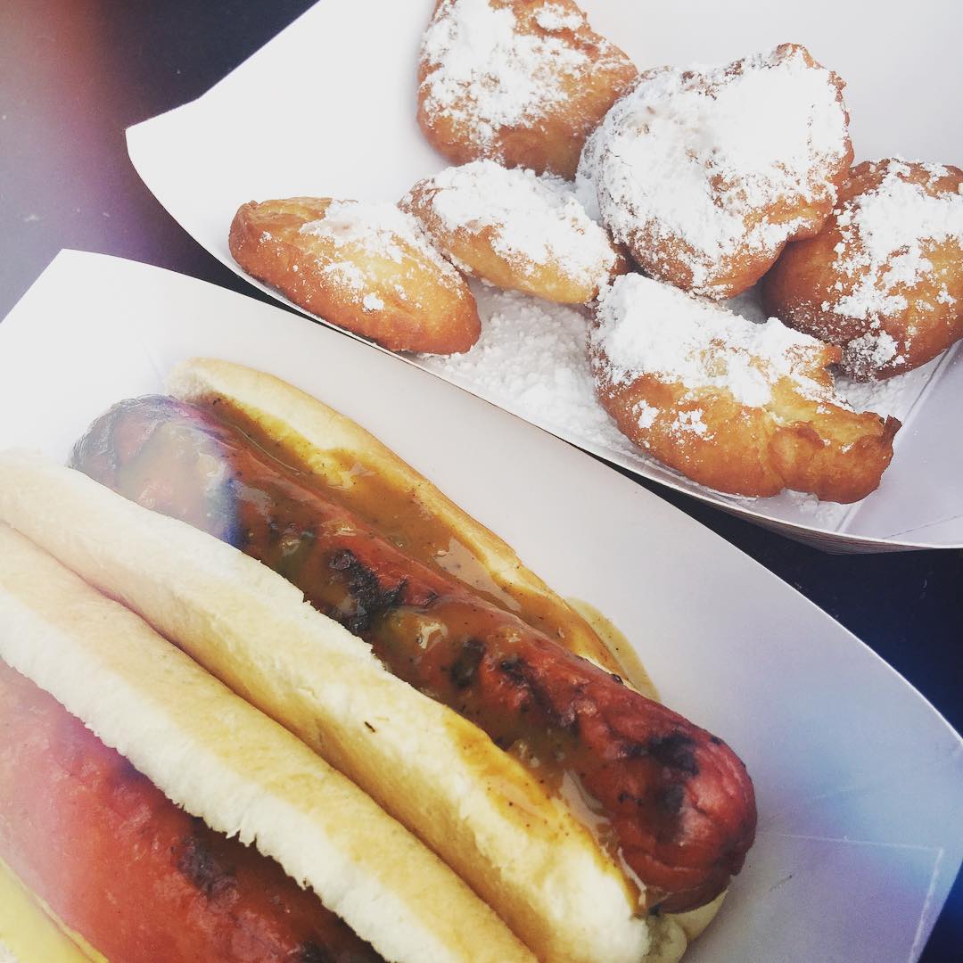 The start of some really good 4th of July food! Hot dogs and beignets... Unfortunately, the boozie pops aren't picture... Already consumed them 👍😂 ❤️⚪️💙 we also have fruit and cheese! Love 4th of July tailgating!