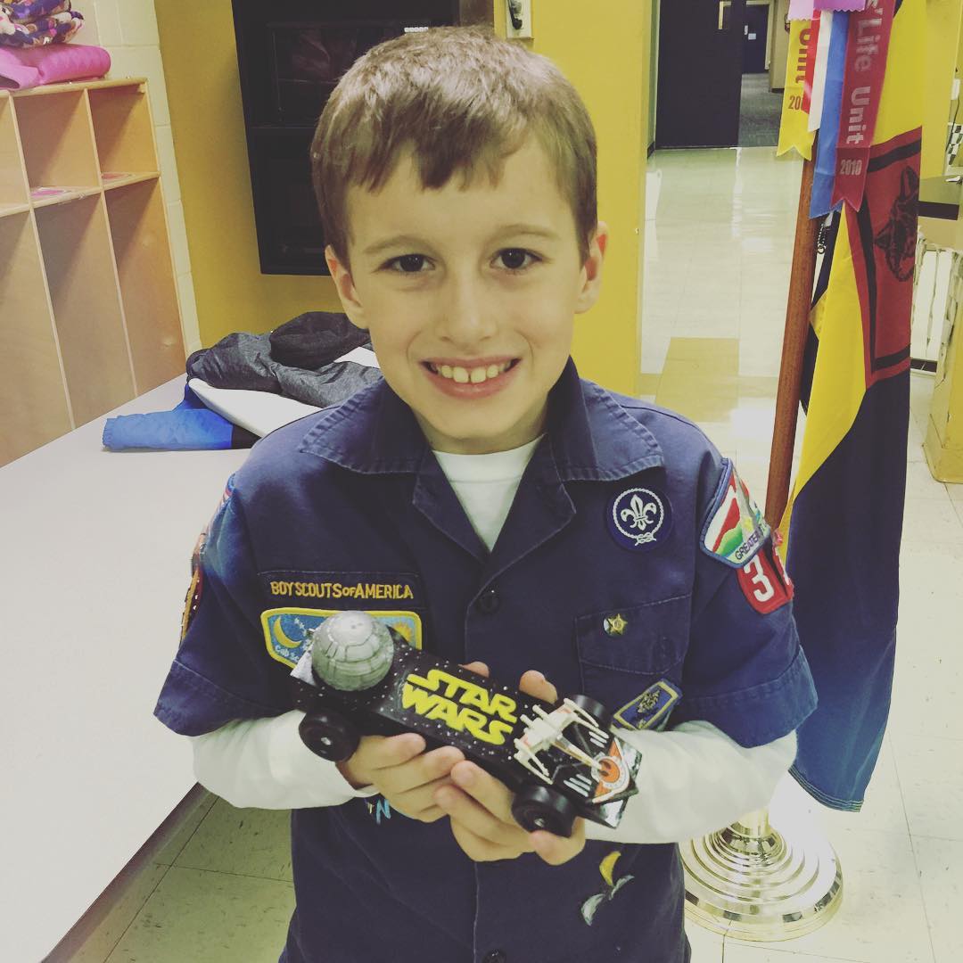 Another Pinewood Derby in the 📚books📚. The Death Star was made on my husband's 3D printer and it even has a tiny LED light in it that makes it light up. We did pretty good this year! 😃👍👏🚦:checkered_f